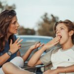 mother talking to her child that seems not interested